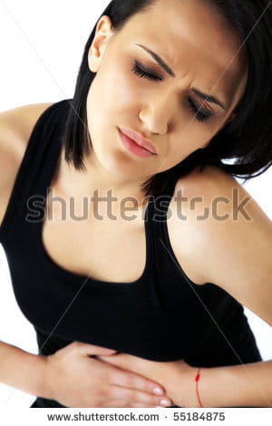 stock-photo-close-up-of-a-beautiful-female-holding-her-stomach-in-pain-55184875