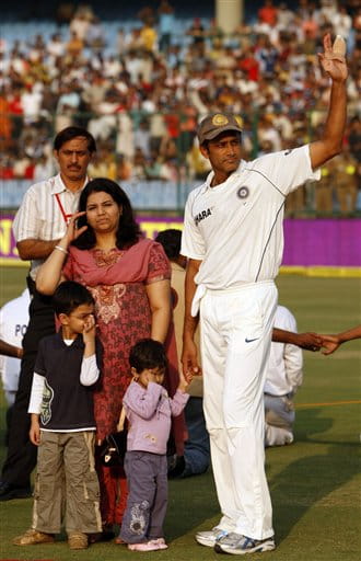 Indian cricket team captain Anil Kumble, right, waves at the crowd as he waits for the presentation ceremony with his wife Chetana and children on the final day of the third test cricket match between India and Australia, in New Delhi, India, Sunday, Nov. 2, 2008. Kumble, the third most successful bowler in test history with 619 wickets, announced his retirement at the end of the third test against Australia. (AP Photo/Saurabh Das)