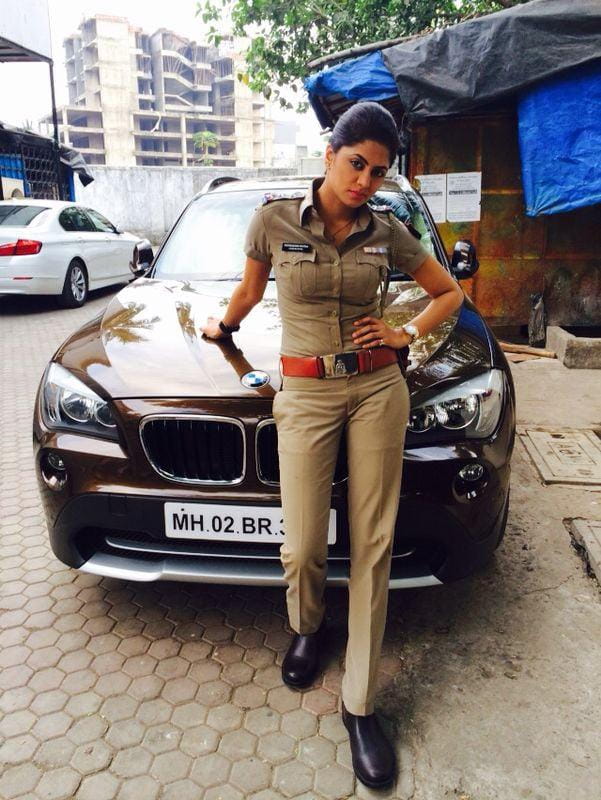 kavita kaushik with her luxury car BMW