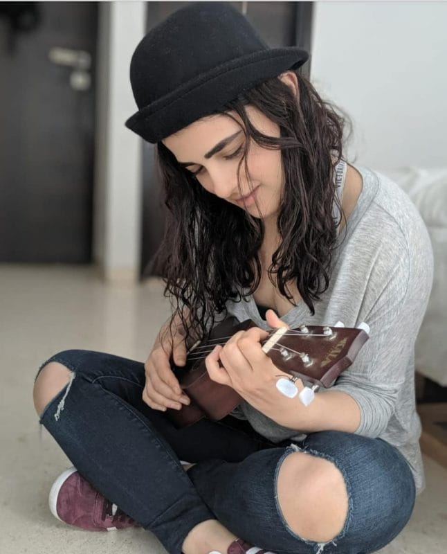 Radhika Madan. playing guitar