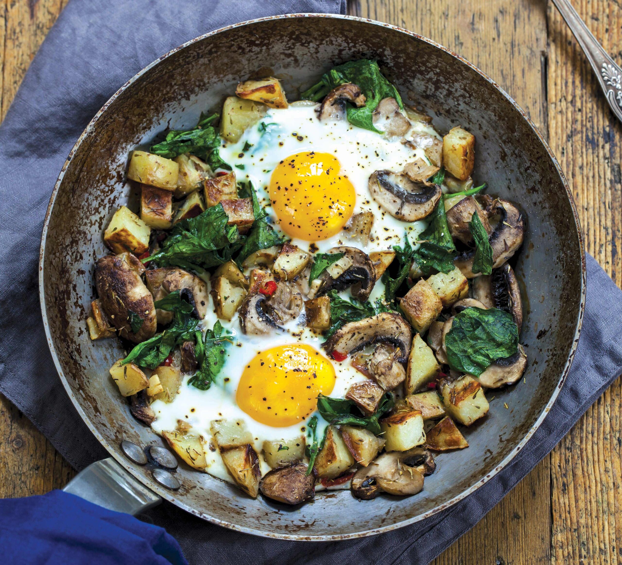 Mushroom-Baked Eggs With Squished Tomatoes